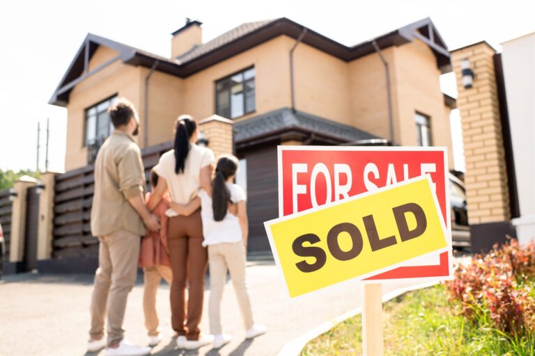 family-looking-at-new-house