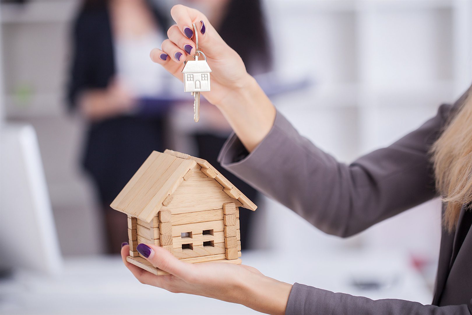real-estate-agent-giving-house-keys-to-a-customer